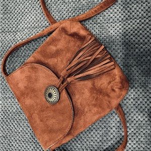 Madden girl sued crossbody bag